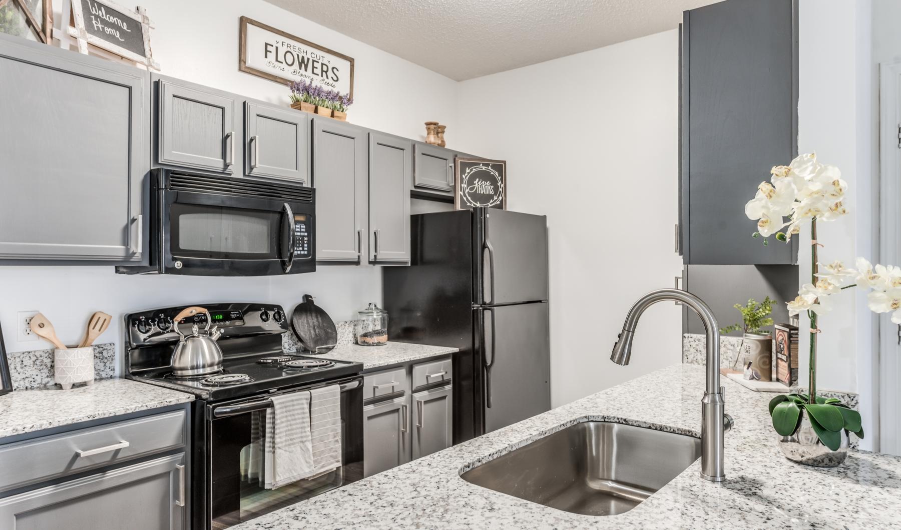 Beautiful kitchens with designer finishes a kitchen with stainless steel appliances