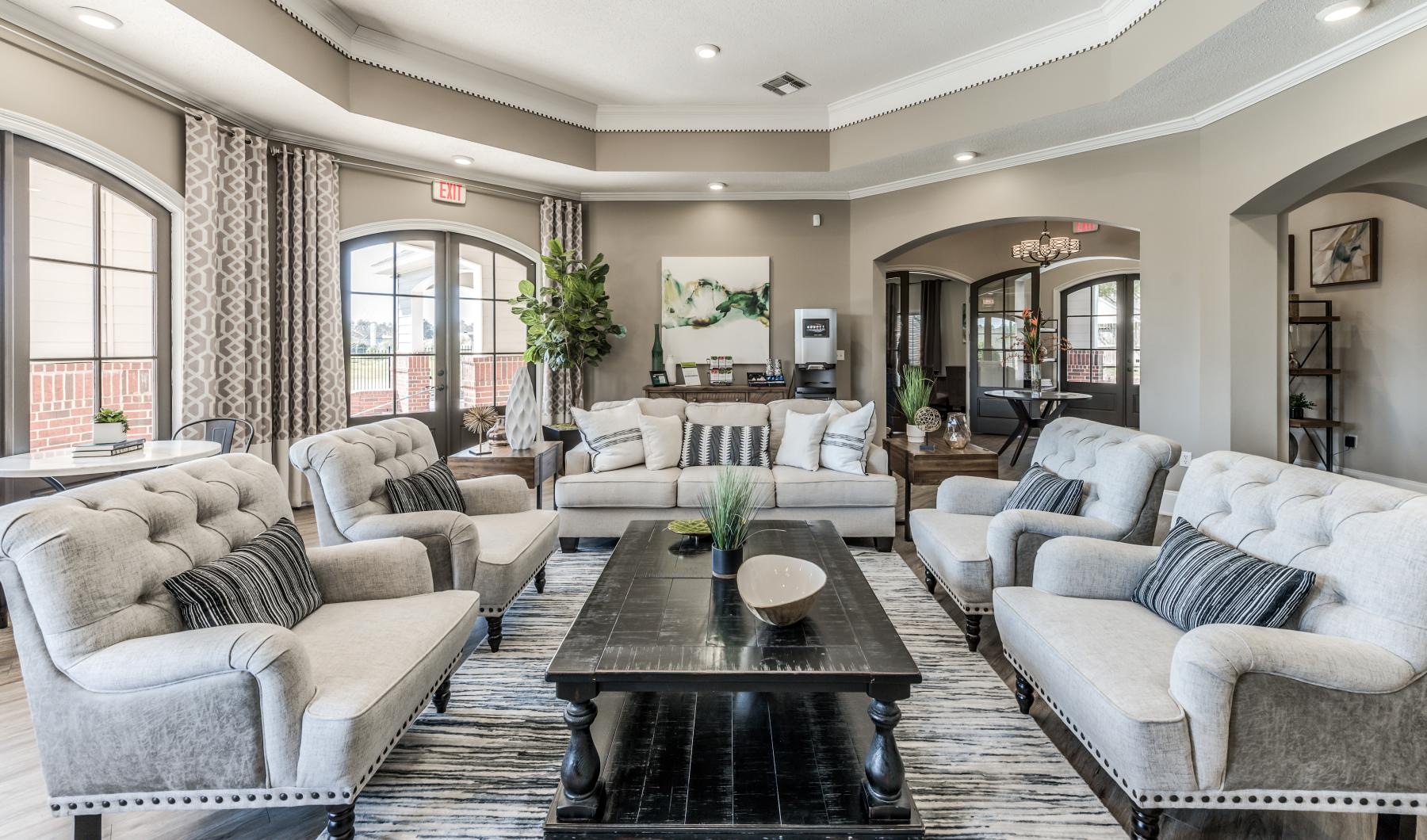 State-of-the-art amenities a clubhouse room with a large glass door