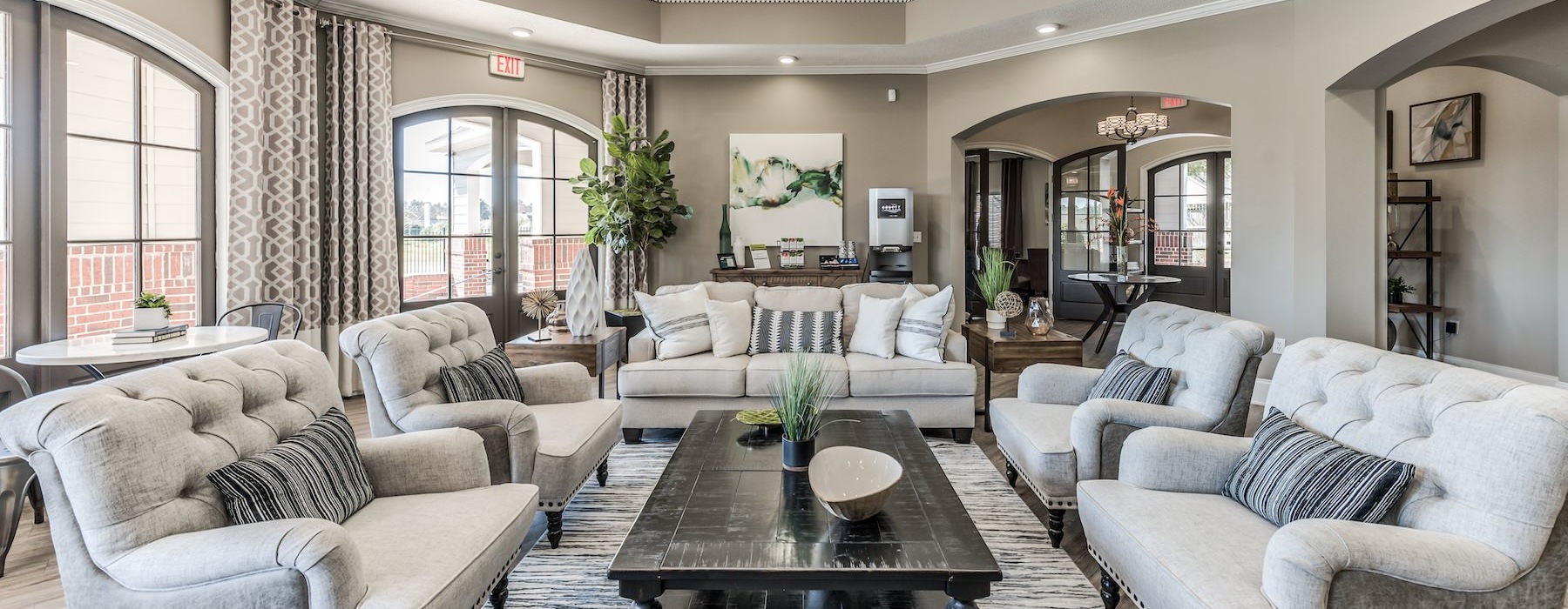 a clubhouse room with a large glass door