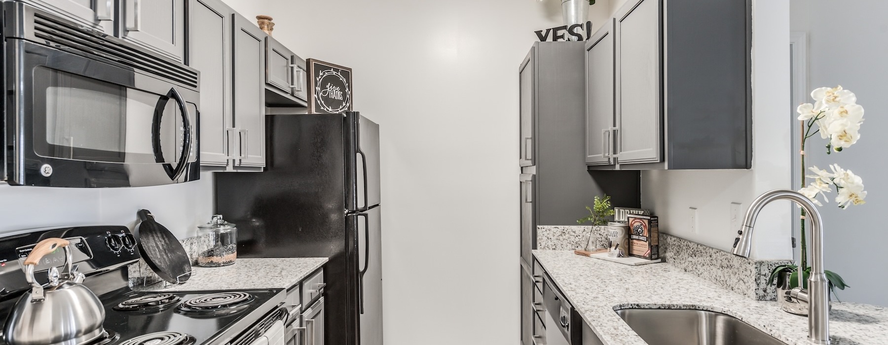 a kitchen with black appliances