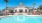 a swimming pool in front of a house