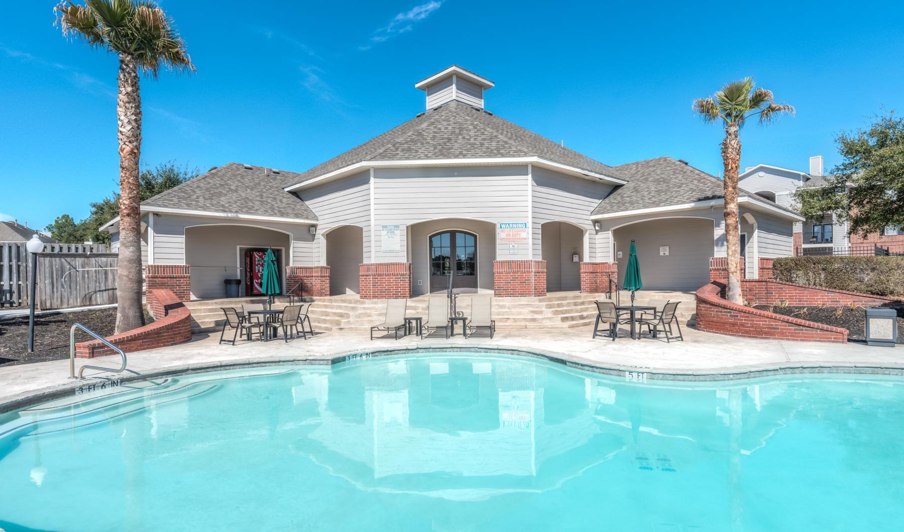 a swimming pool in front of a house