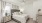 a bedroom with a bed and a fan