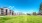 a large building with a lawn in front of it