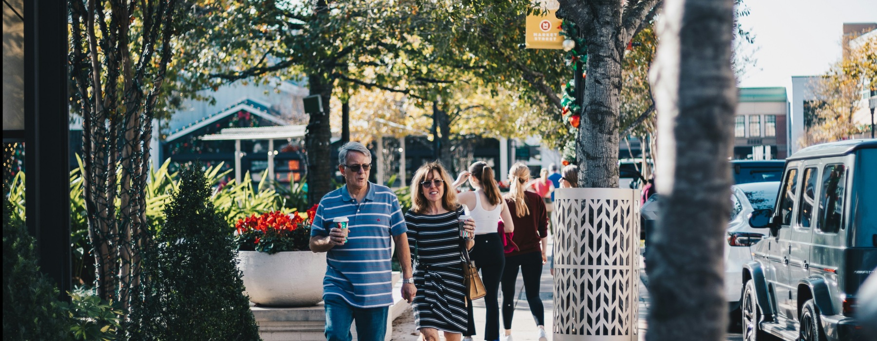 people walking down a shopping corridor