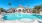 a swimming pool in front of a house