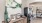 a clubhouse room with a water cooler and a table